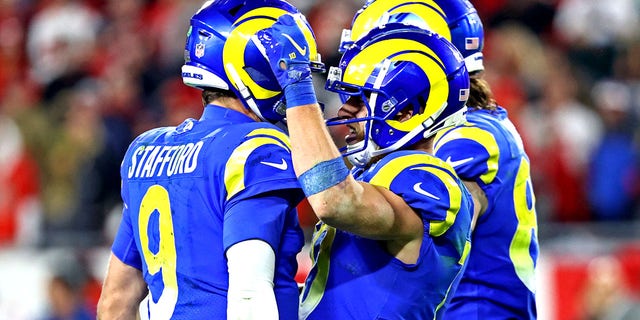 Los Angeles Rams quarterback Matthew Stafford (9) celebrates with wide receiver Cooper Kupp (10) after a play during the second half against the Tampa Bay Buccaneers in a NFC Divisional playoff football game at Raymond James Stadium.