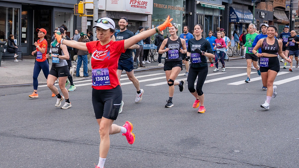 Marathon runners pose for camera