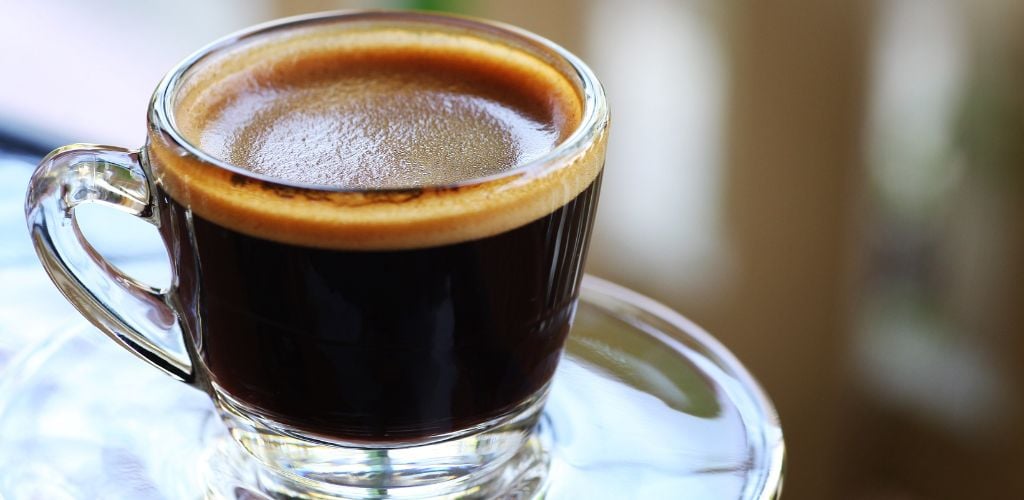 close up of Americano coffee in glass mug 