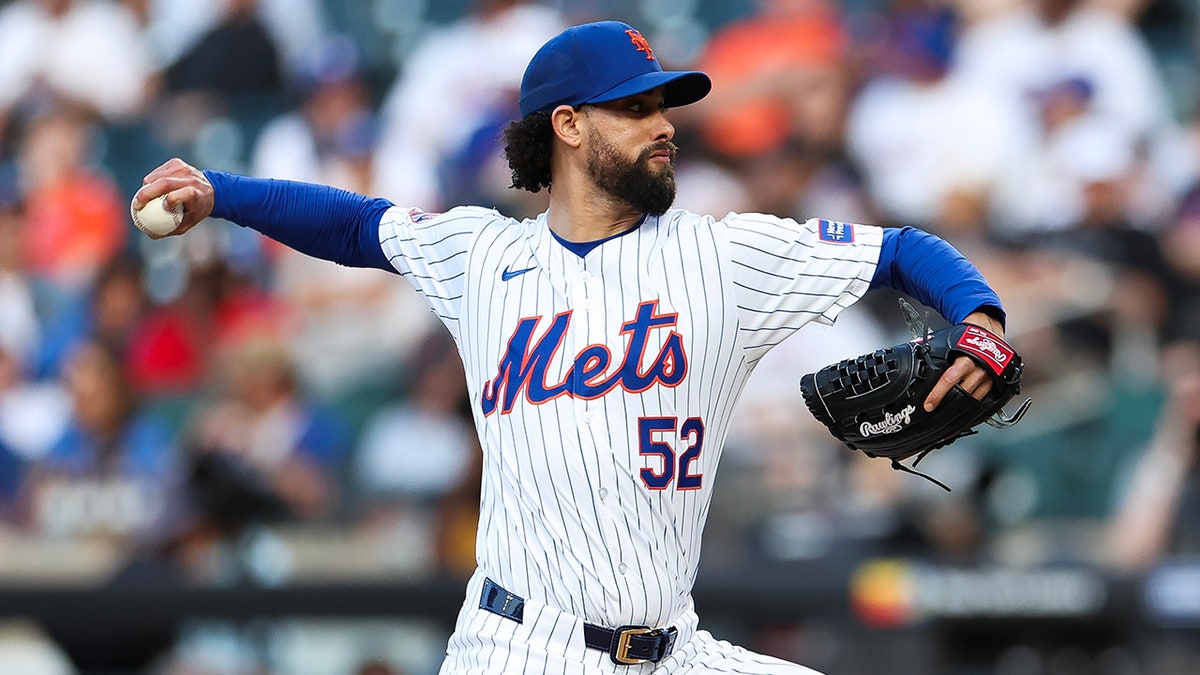 Jorge Lopez throws a pitch against the Dodgers