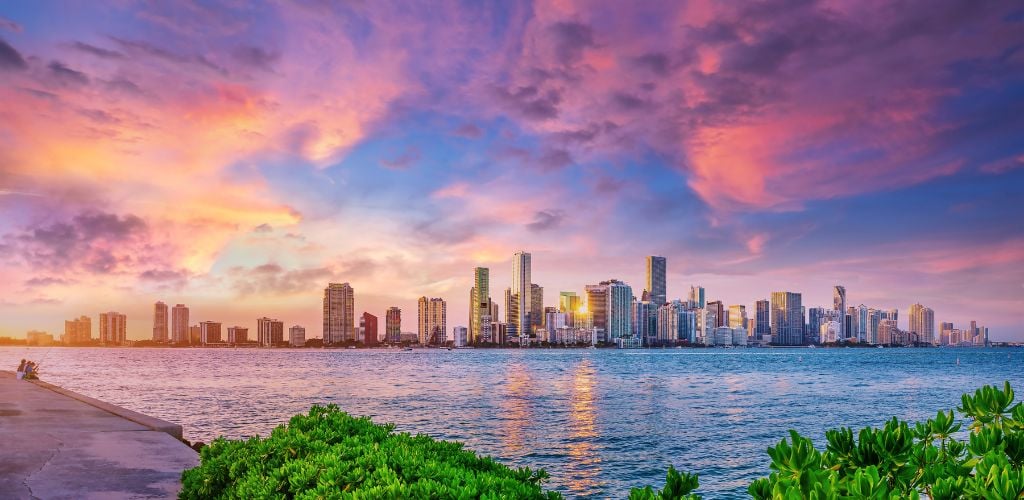 The skyline of Miami while sunset. 