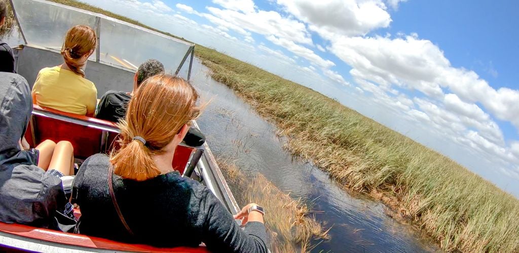 Tourists visit the National Park by airboat. The park is a major attraction in Florida. 