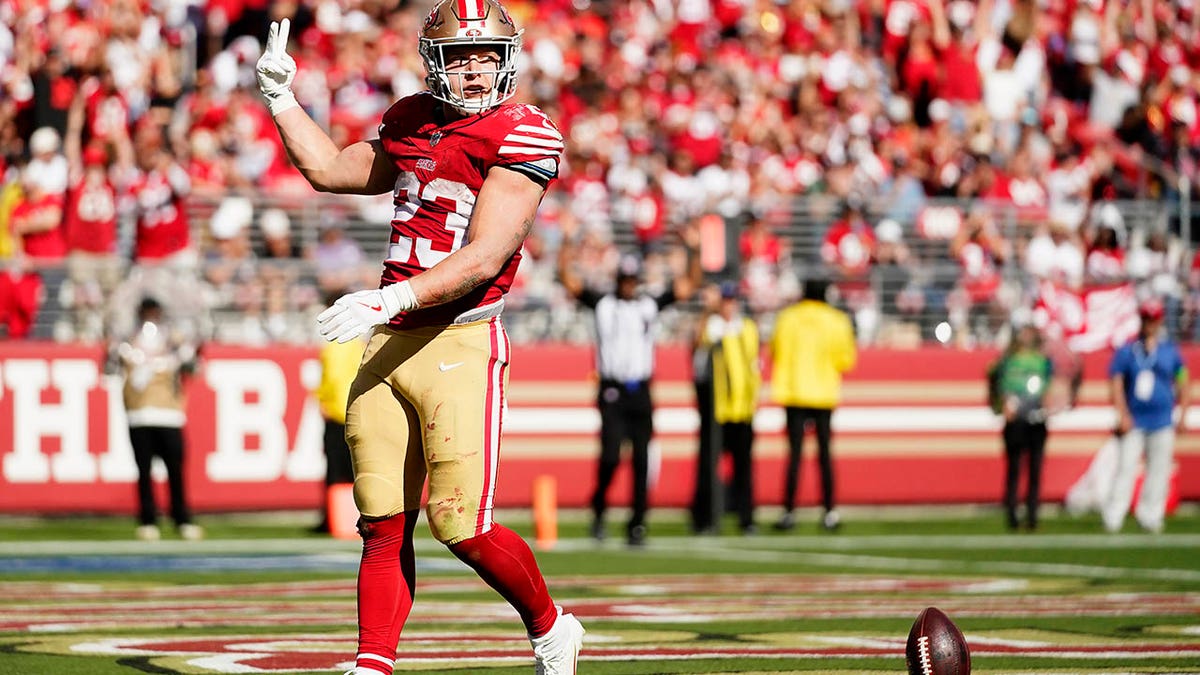 Christian McCaffrey celebrates a TD