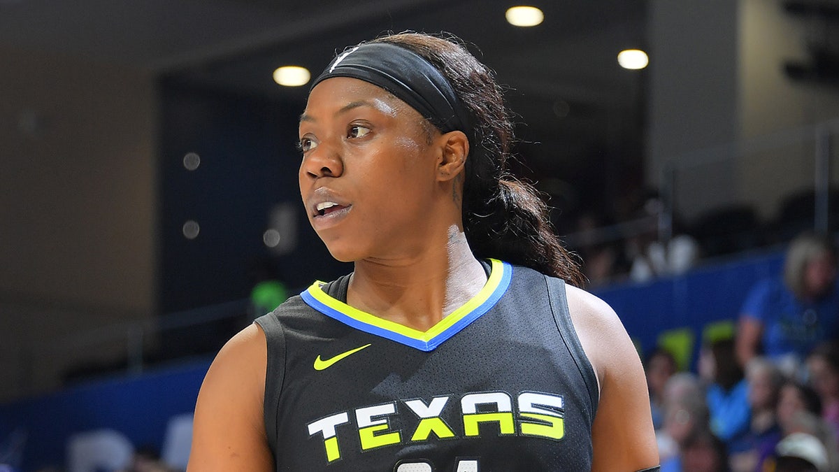 Arike Ogunbowale looks on during a WNBA game