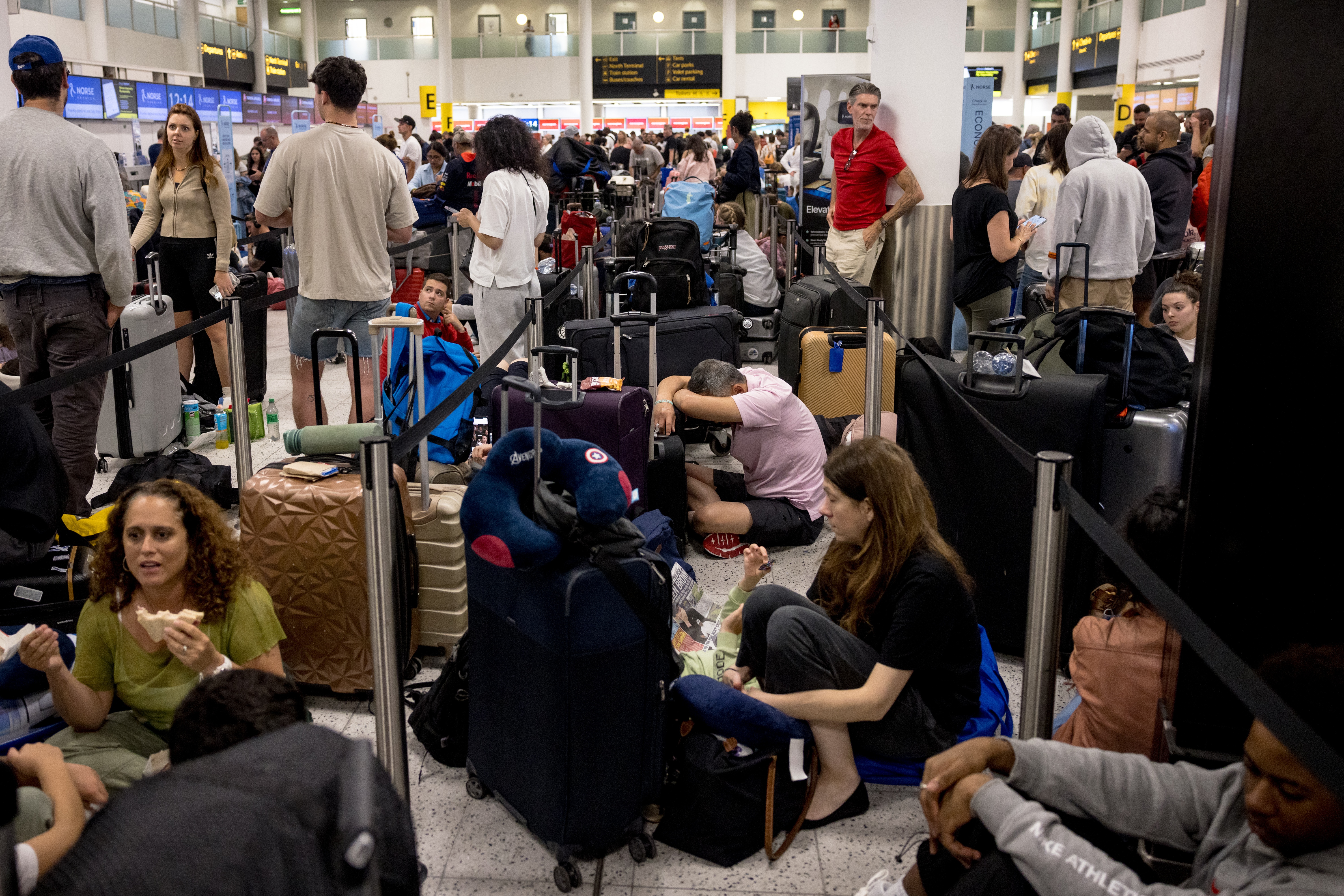 Passengers line up at London