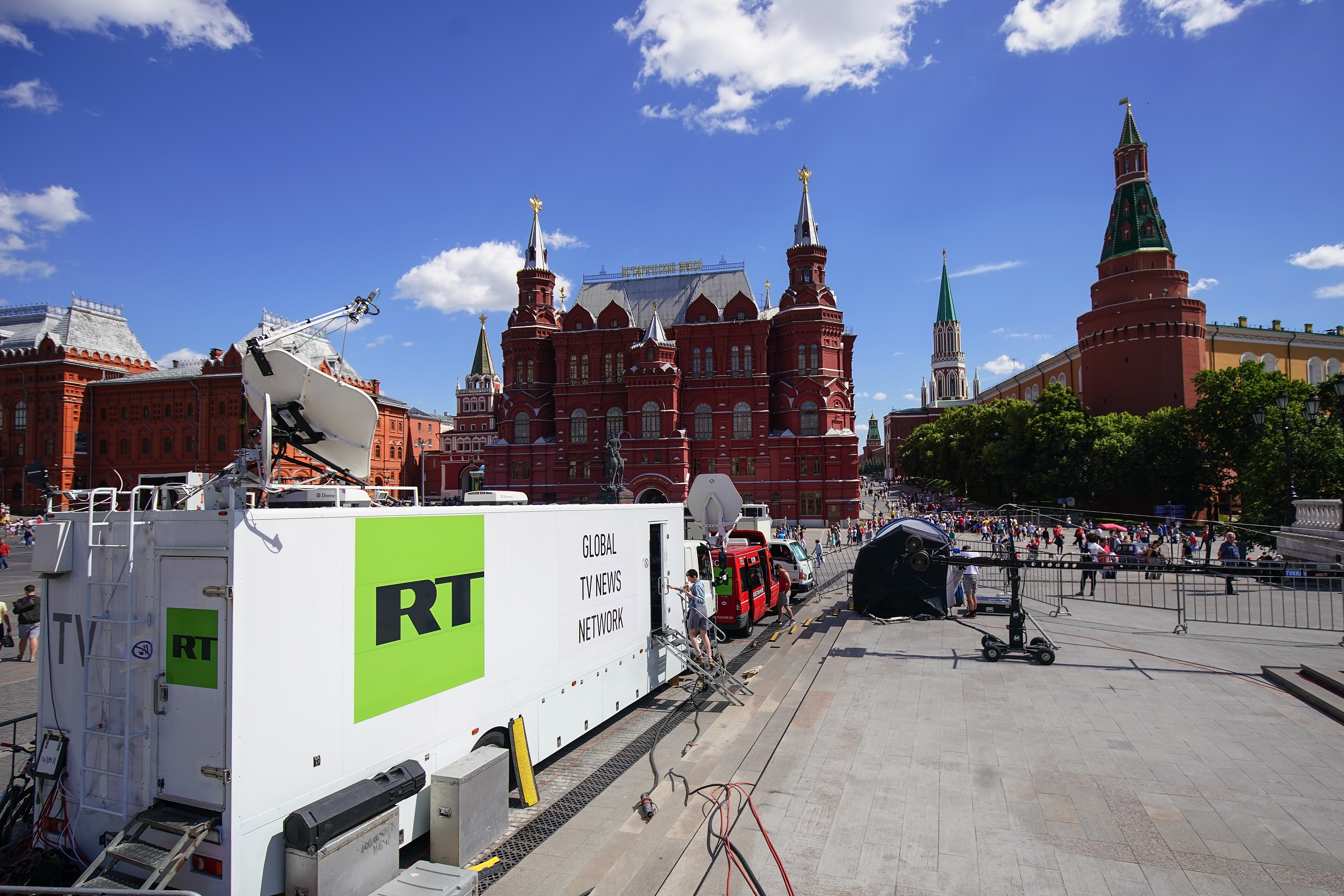 Russian state broadcaster RT broadcasting from near Red Square during the 2018 World Cup in Moscow. The Justice Department alleges an RT employee was behind an AI-powered effort to create fake social media profiles of Americans to spread Russian propaganda in the U.S. 