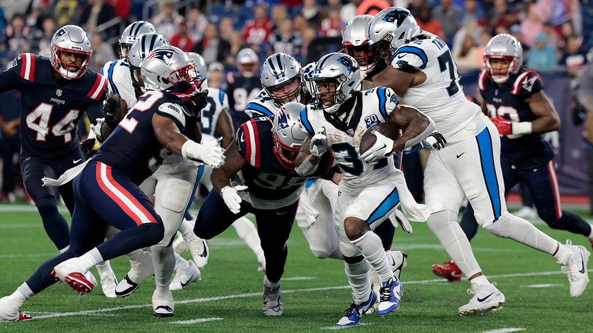 Mike Boone carries the ball