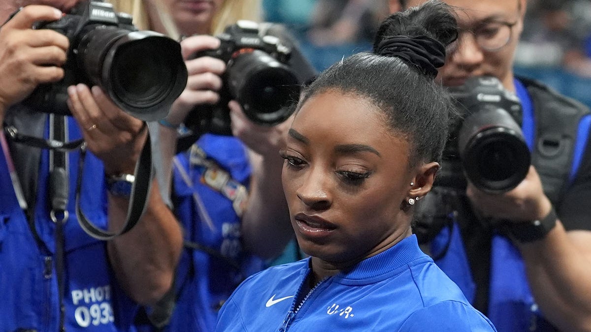 Simone Biles looks downcast