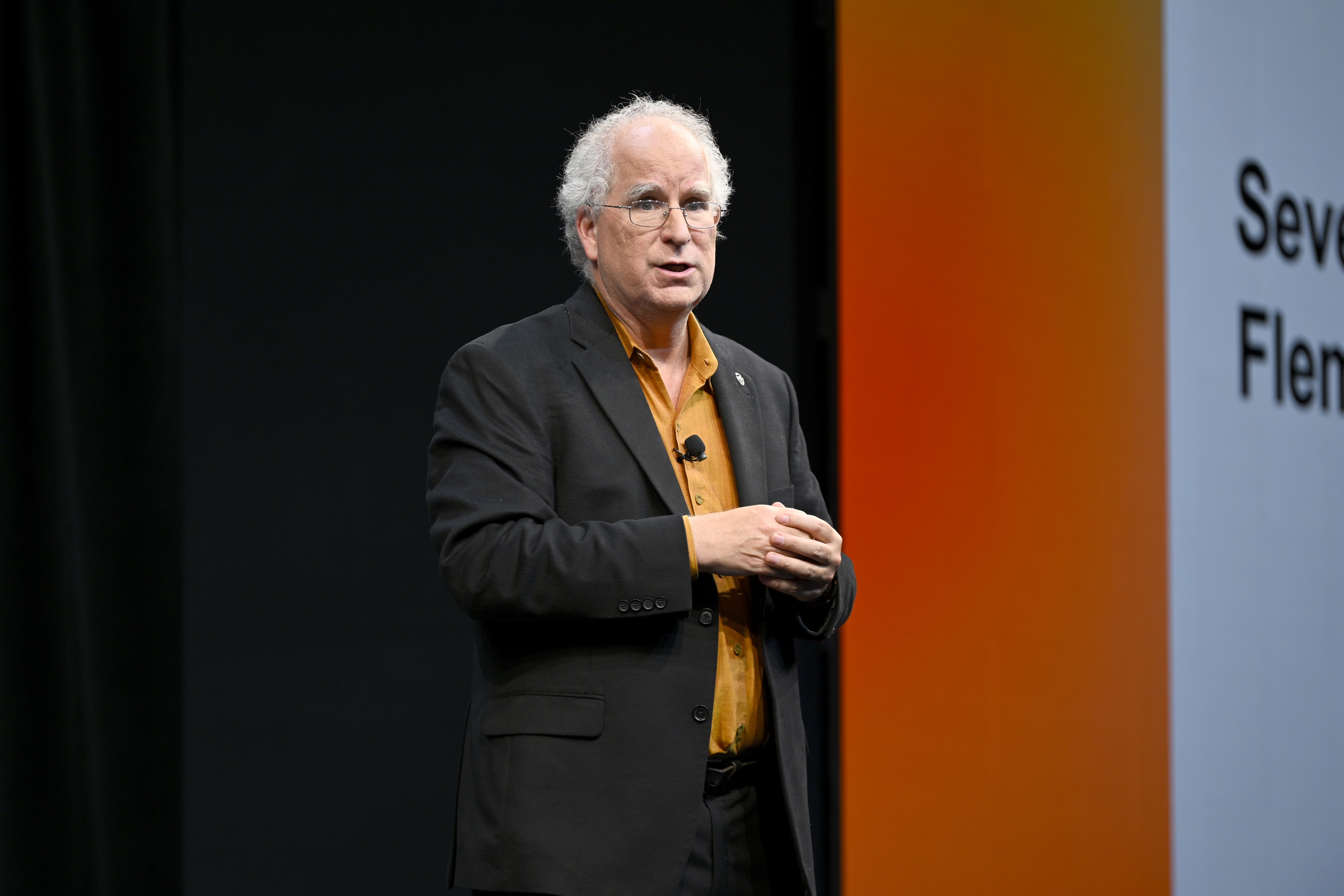 Internet Archive founder Brewster Kahle speaks onstage in 2022 in New York City. He said a cyberattack on the nonprofit, which advocates for universal access to all knowledge, affected more than 31 million of its users.