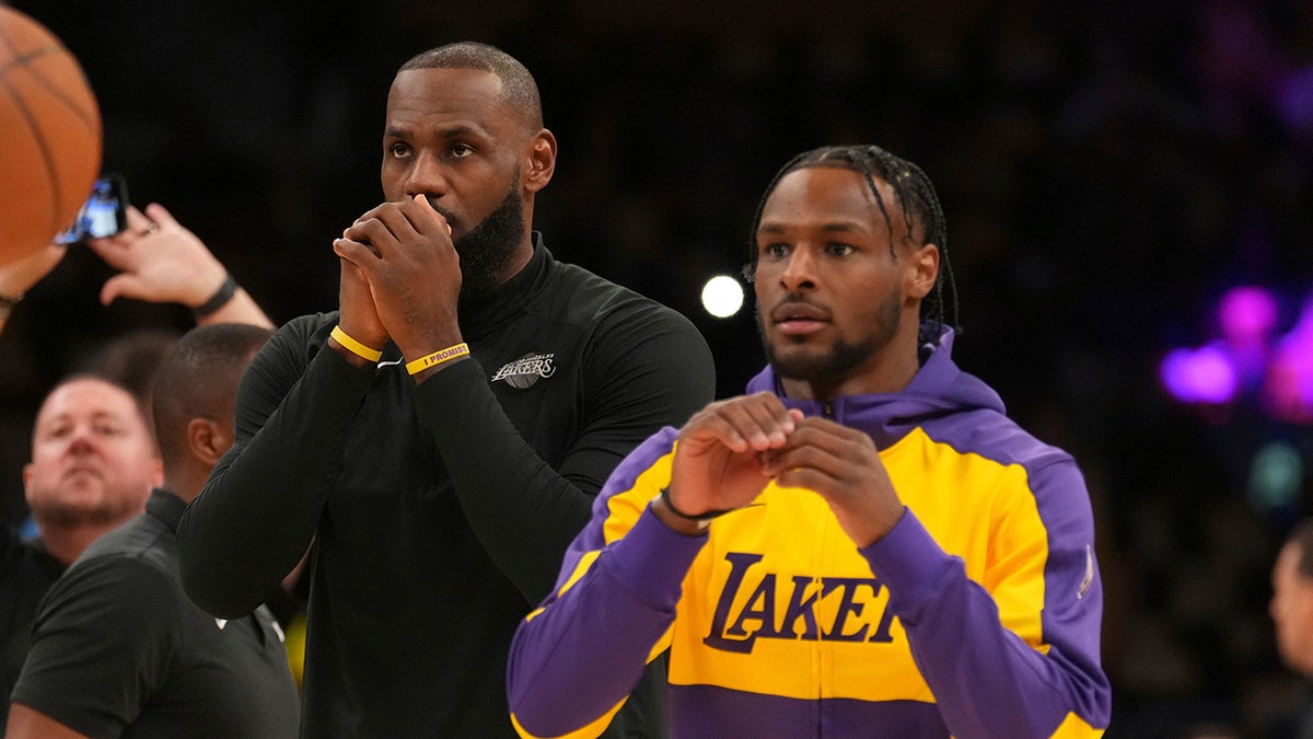 LeBron and Bronny James warm up