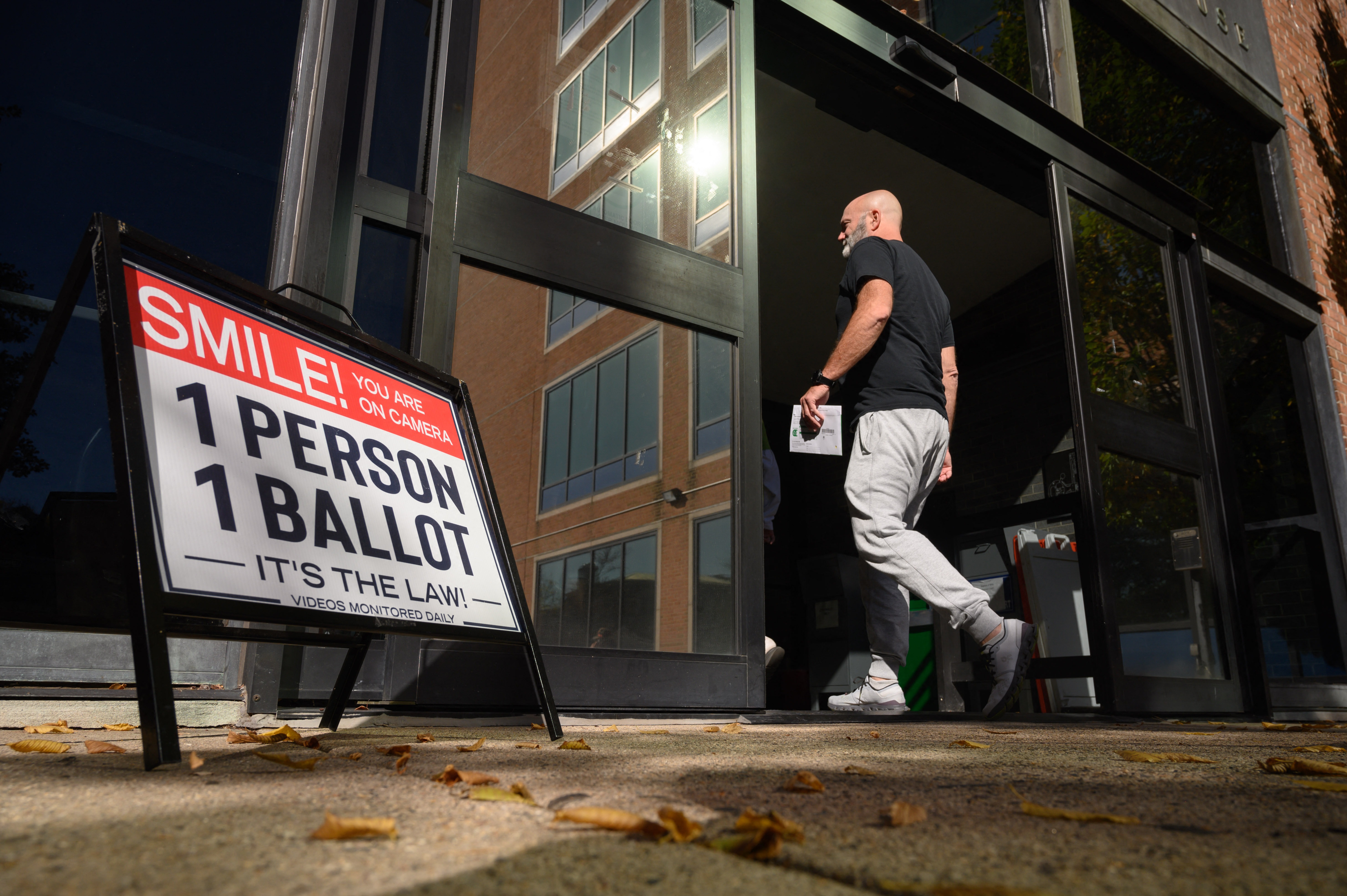 A voter enters the Bucks County Administration building in Doylestown, Pa. on Oct. 31, 2024.