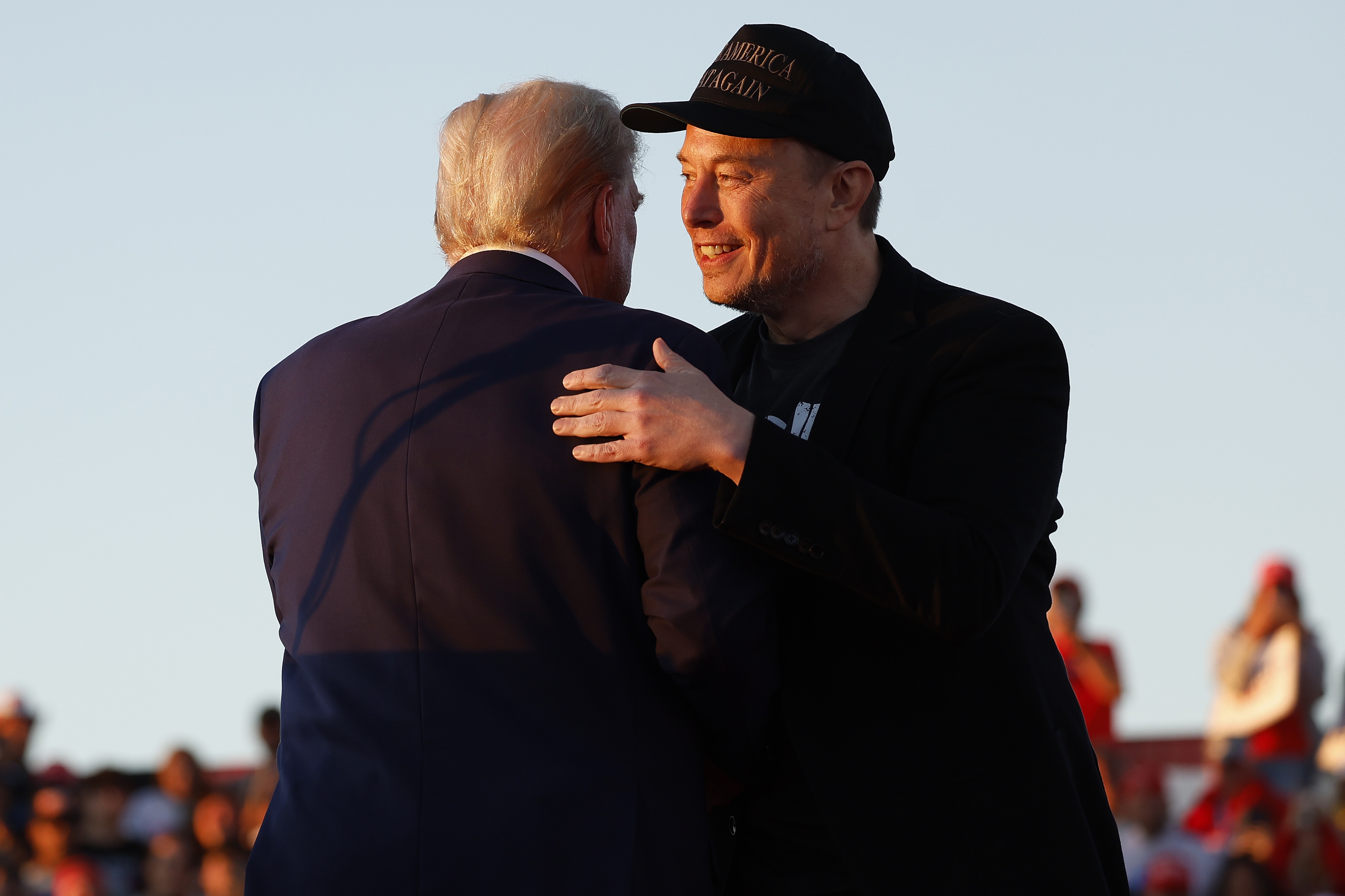 President-elect Donald Trump embraces Elon Musk during an October campaign rally in Butler, Pennsylvania. Over the last few months, the two men have cultivated a warm relationship.