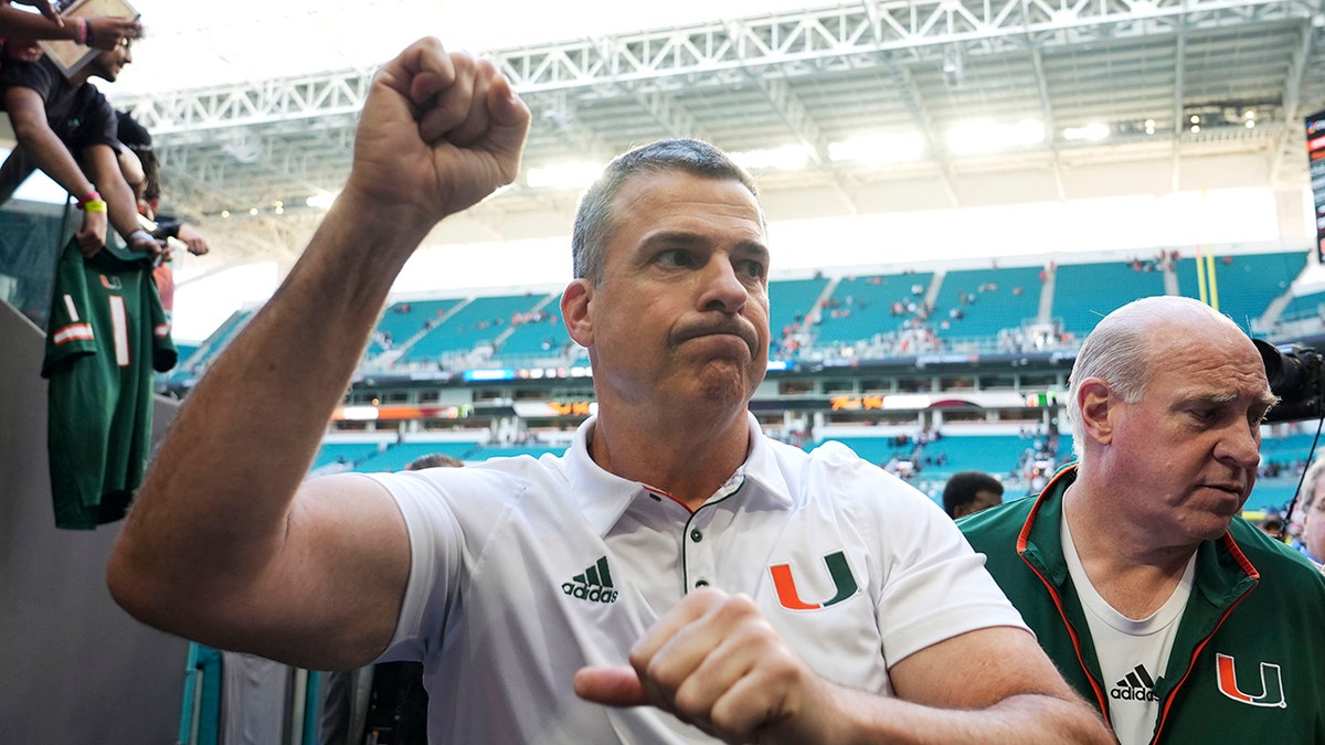 Mario Cristobal walks off the field