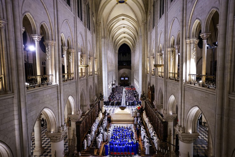 The choir, Clergy and guests stand.