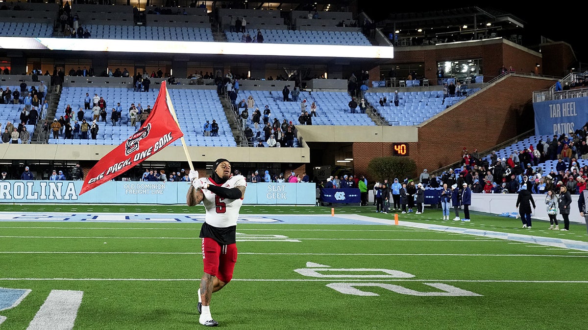 NC State player waving flag