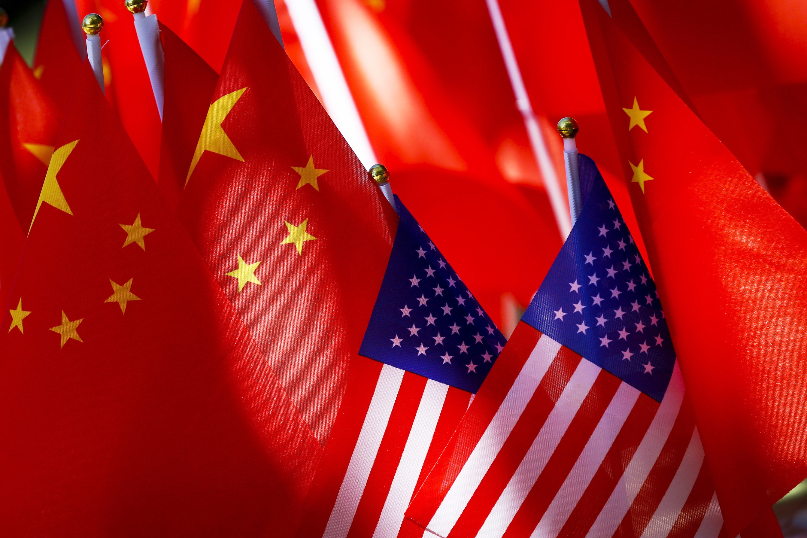 American flags are displayed with Chinese flags on top of a trishaw on Sept. 16, 2018, in Beijing.