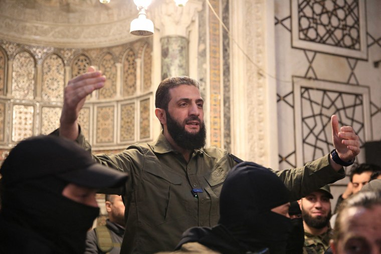 The leader of Syria's Islamist Hayat Tahrir al-Sham (HTS) group that headed a lightning rebel offensive snatching Damascus from government control, Abu Mohammed al-Jolani, address a crowd at the capital's landmark Umayyad Mosque on December 8, 2024.