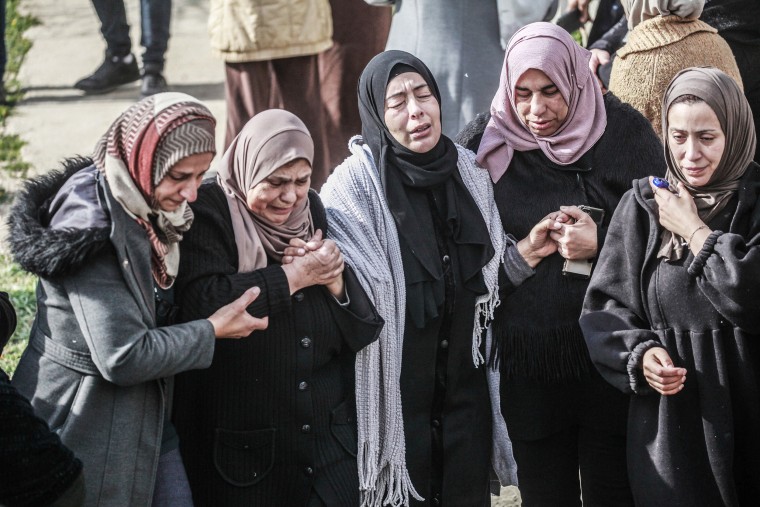 Palestinian women mourn over the body of 15-year-old