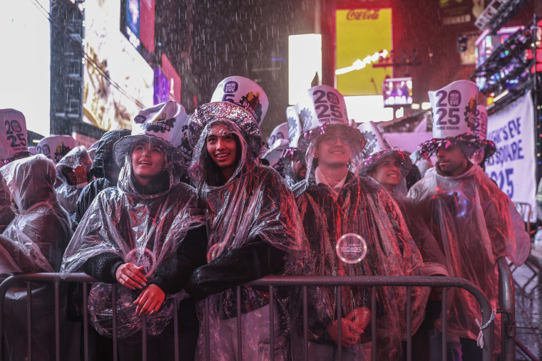 Revelers wear ponchos in the rain during the annual New Year's Eve celebration in Times Square