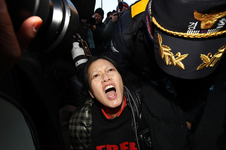 A Seoul court issued a warrant to detain impeached President Yoon Suk Yeol over his botched martial law imposition, making him the first sitting South Korean president to face arrest.