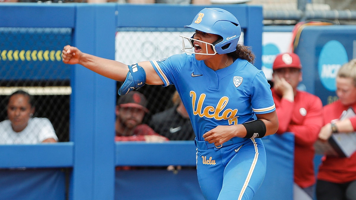 Maya Brady reacts after hitting homer