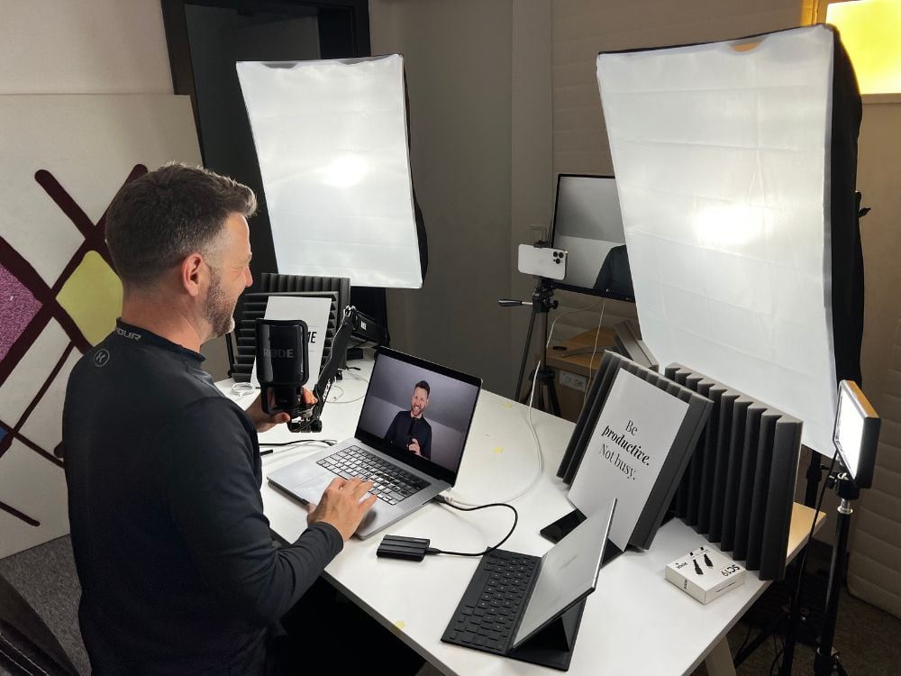 Nick Filming Recording Studio, home office set up including laptop and studio lighting