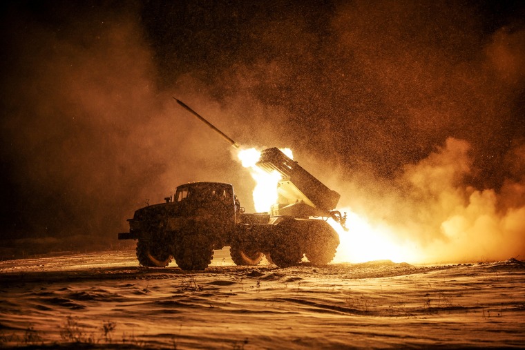 Ukrainian servicemen fire a BM-21 Grad multiple-launch rocket system toward Russian troops on a front line near the town of Chasiv Yar