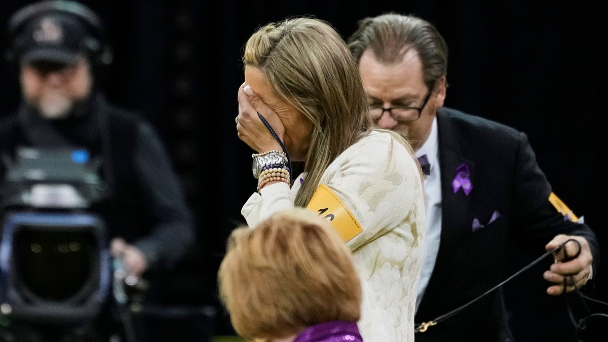 Katie Bernardin, center, reacts