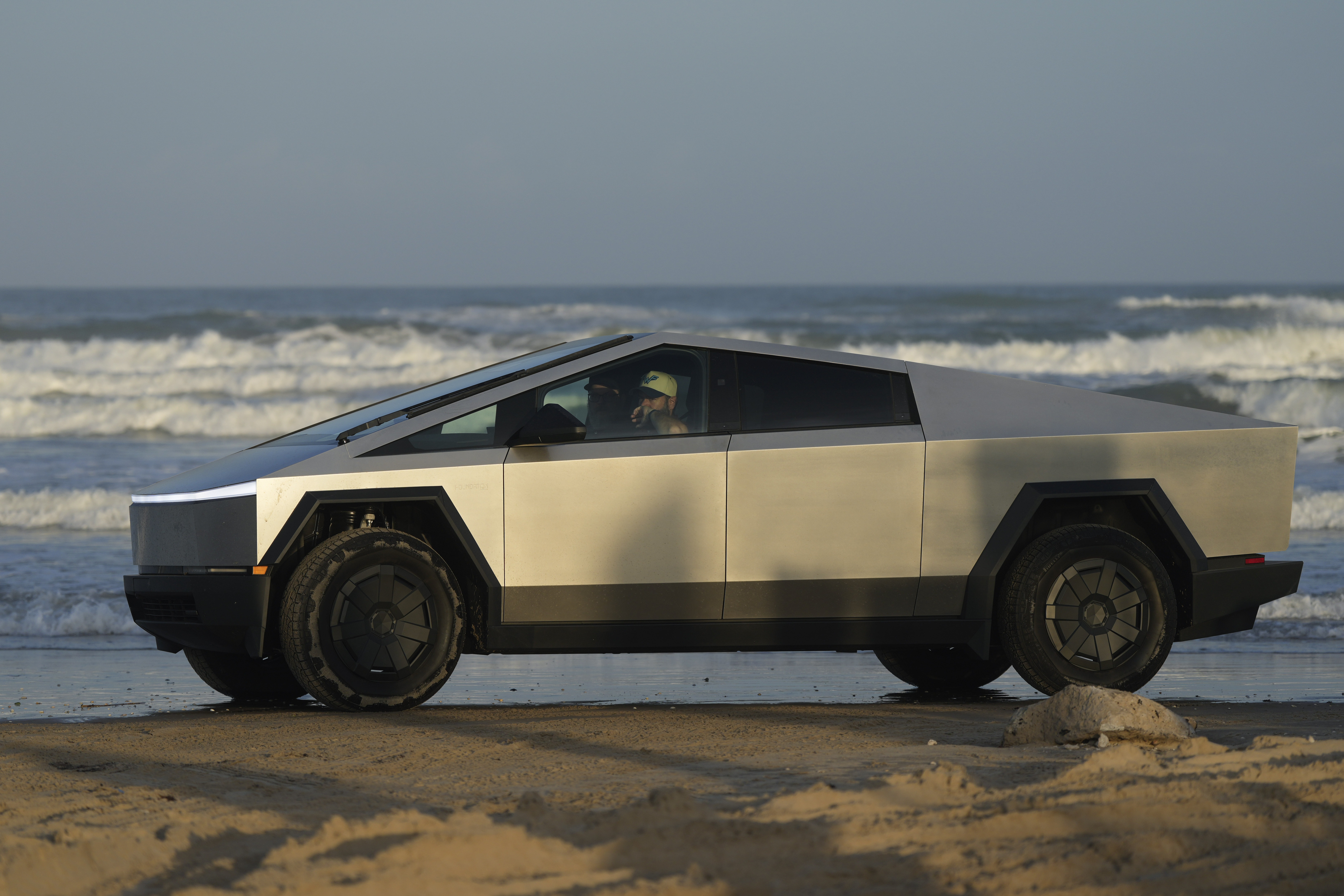 A Tesla Cybertruck moves along the beach in Boca Chica, Texas, on Nov. 18, 2024.