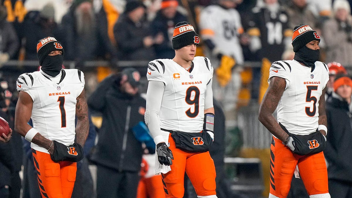 Cincinnati Bengals wide receiver Ja'Marr Chase, #1, quarterback Joe Burrow, #9, and wide receiver Tee Higgins, #5, take the field as captains for the coin toss before the first quarter of the NFL Week 18 game between the Pittsburgh Steelers and the Cincinnati Bengals at Acrisure Stadium in Pittsburgh on Saturday, Jan. 4, 2025.