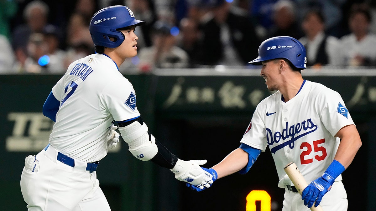 Shohei Ohtani celebrates with Tommy Edman